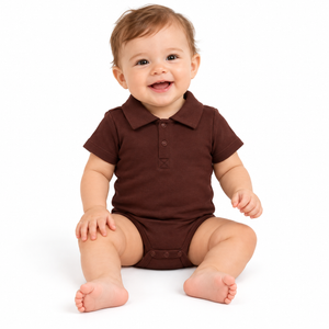 Baby modeling chocolate brown short-sleeve polo onesie against pure white