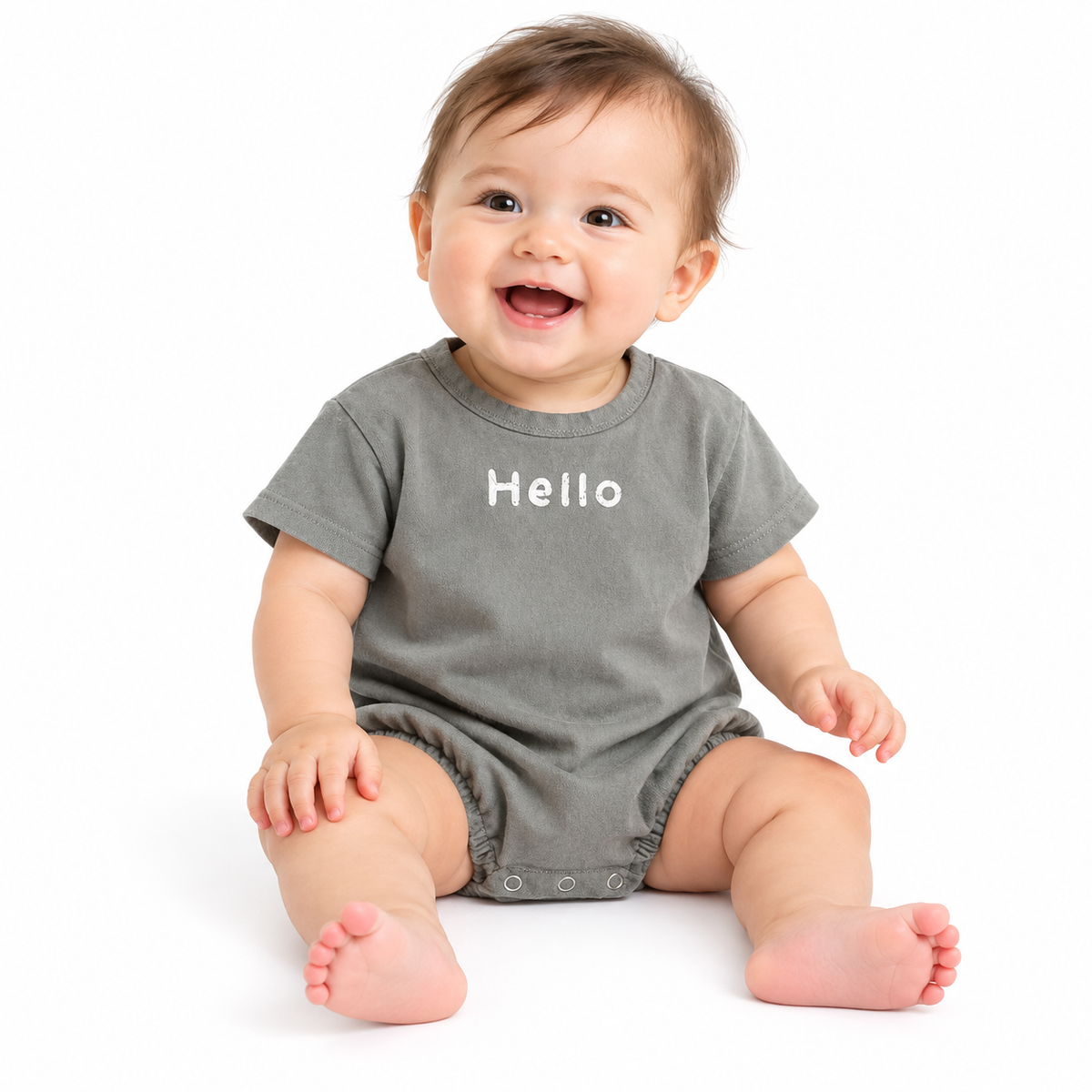 Baby in gray Hello romper on pure white background